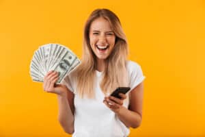 passive income apps Happy Woman Holding Cash Made From Survey App