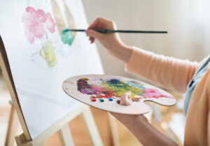 woman painting crafts to make and sell