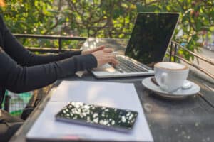Best Weekend Jobs Woman hand writing notes in the sunny morning