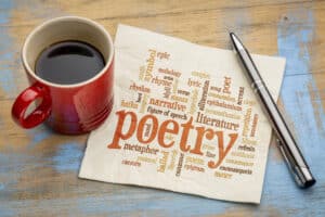 get paid to write poems poetry word cloud on a napkin with a cup of coffee