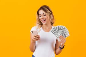 Best odd jobs apps, woman holding smartphone and cash