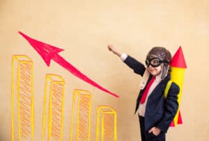 Jobs For 10-Year-Olds Portrait of young businessman with paper rocket. Success, creative and startup concept. Copy space for your text