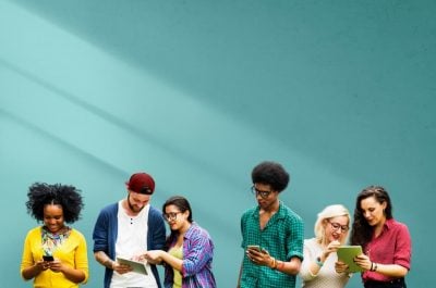 Social Media group of people using phones and tablets together